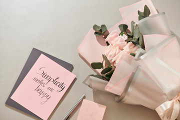 Sticker - Gift box, alarm clock and pink rose flowers on white table top view in flat lay style. Greeting card for Mother or Woman day.