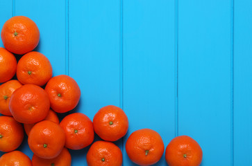 Wall Mural - Tangerine on wood table background