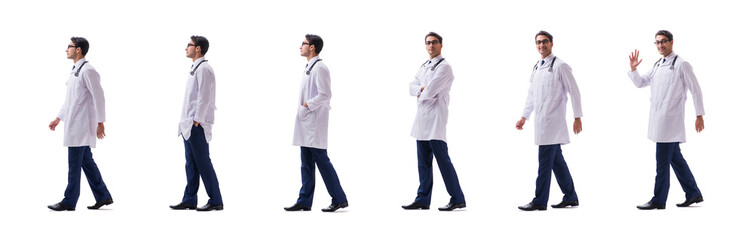 Wall Mural - Young doctor physician standing walking isolated on white backgr