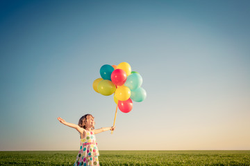 Sticker - Happy child playing outdoors in spring field