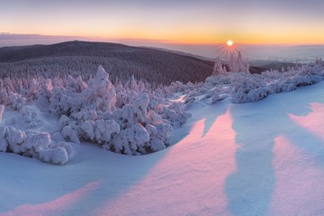 Wall Mural - Mountain landscape panoramic view with blue sky Gorgeous winter sunset in Carpathian mountains. Colorful outdoor scene, Happy New Year celebration concept. Panorama of white winter mountains with snow