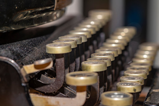 Detail of a historic dusty portable typewriter made in Germany during the twenties of the 20th century.