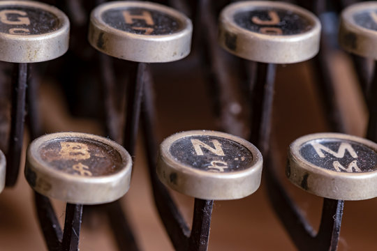 Detail of a historic dusty portable typewriter made in Germany during the twenties of the 20th century.