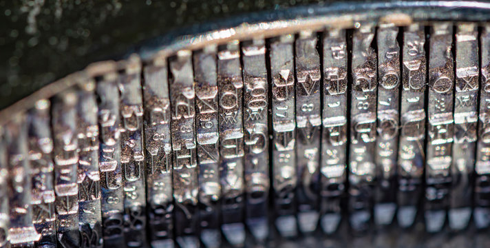 Detail of a historic dusty portable typewriter made in Germany during the twenties of the 20th century.