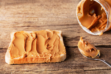 Wall Mural - peanut butter sandwich on wooden background