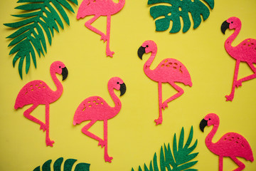  Tropical summer bright background with many plant leaves and flamingos.