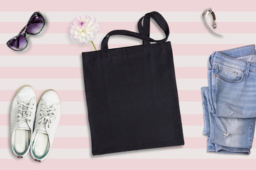 Wall Mural - Black tote bag mockup, flat lay on summer style background 