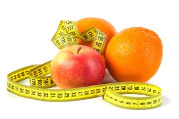 Apples and orange with measure tape on white background, healthy diet