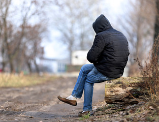 lonely man in the hood, homeless, Poland