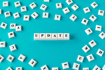 Business or education concept of updating a system, offer or personal knowledge and abilities - plastic cubes with letters to read Update.