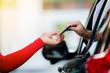 Selective focus to woman driver pay credit card