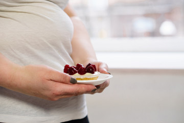 Wall Mural - sugar addiction, lifestyle, weight loss, dietary, cheat meal, diet restrictions. healthy and unhealthy food. cropped portrait of overweight woman fighting the temptation to eat sweet cake
