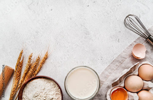 Cuadros en Lienzo Baking ingredients with a linen tablecloth on marble background