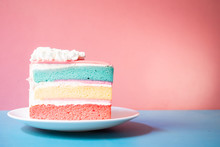 Layer Rainbow Cake With Spoon Wooden On Pink Background