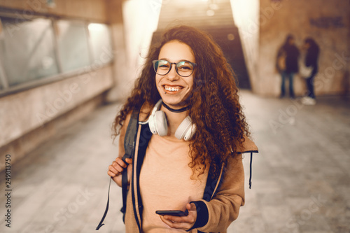 Cute Mixed Race Hipster Teenage Girl With Toothy Smile And Long