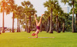 © romaset - Beautiful young woman practic yoga at the beach. Early morning exercise