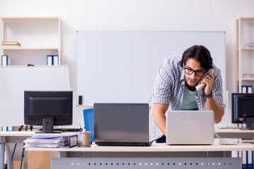 Wall Mural - It specialist working in the office 