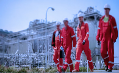 Abstract, blur background, defocusing - image for the background. Business partners. Industrial worker on the assembly and maintenance at the refinery production of gasoline