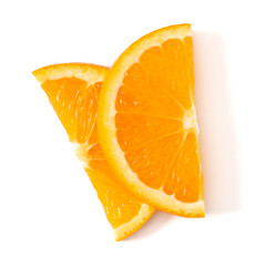 Orange fruit slice layout isolated on white background closeup. Food background. Flat lay, top view.