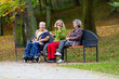 © Adam Wasilewski - family in the park sitting on a bench