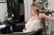 © strigana - Professional hairdresser makes curls using curling