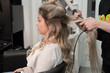 © strigana - Professional hairdresser makes curls using curling