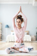 © BestForYou - Young attractive smiling woman practicing yoga, Lotus exercise.
