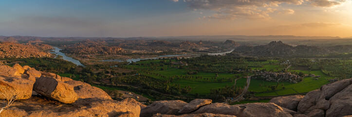 Wall Mural - panoramic view at sunset from the monkey temple hill over hampi india karnakata