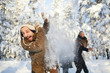 © Seventyfour - Portrait of happy family enjoying snowball fight in beautiful winter forest, focus on bearded man in foreground, copy space