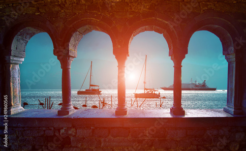 magical sea view through the castle and gothic Church of St. Peter arches in ...