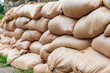 Temporary dam of sandbags. Concept of protection against natural disasters. Selective focus