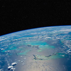 caribbean seascape from space with stars above. elements of this image furnished by nasa.