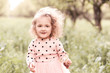© morrowlight - Smiling blonde baby girl 3-4 year old posing outdoors close up. Childhood.
