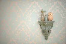 Decor Element With Vintage Toys Owl And Bunny In The Green Wall In Bedroom