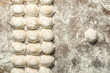 © Алексей Еремеев - Uzbek national food Chuchvara, like dumplings, on a wooden board, in flour