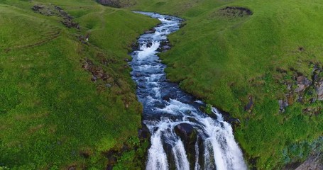 Wall Mural - aerial drone footage of waterfall seljalandsfoss on iceland in icelandic nature. famous tourist attr