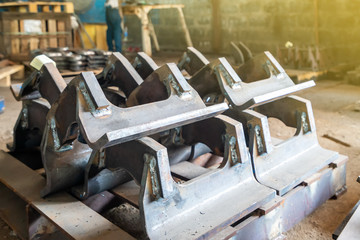 Wall Mural - steel parts after assembly by welding for industrial place on wood palette at factory