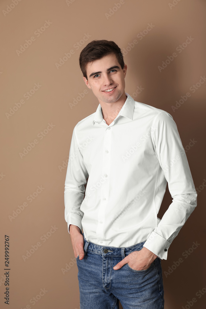 Portrait of handsome young man on color background