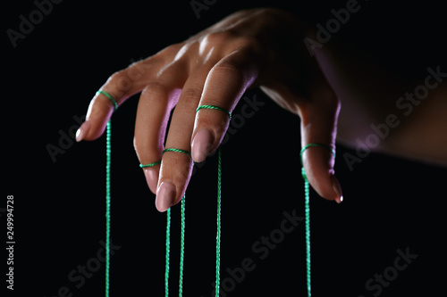Fotomural Hand of puppeteer on dark background
