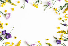 Flowers Composition. Yellow And Purple Flowers On White Background. Spring, Easter Concept. Flat Lay, Top View, Copy Space