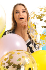 Wall Mural - Beautiful young woman with balloons on white background