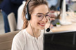 © Pixel-Shot - Female technical support agent working in office