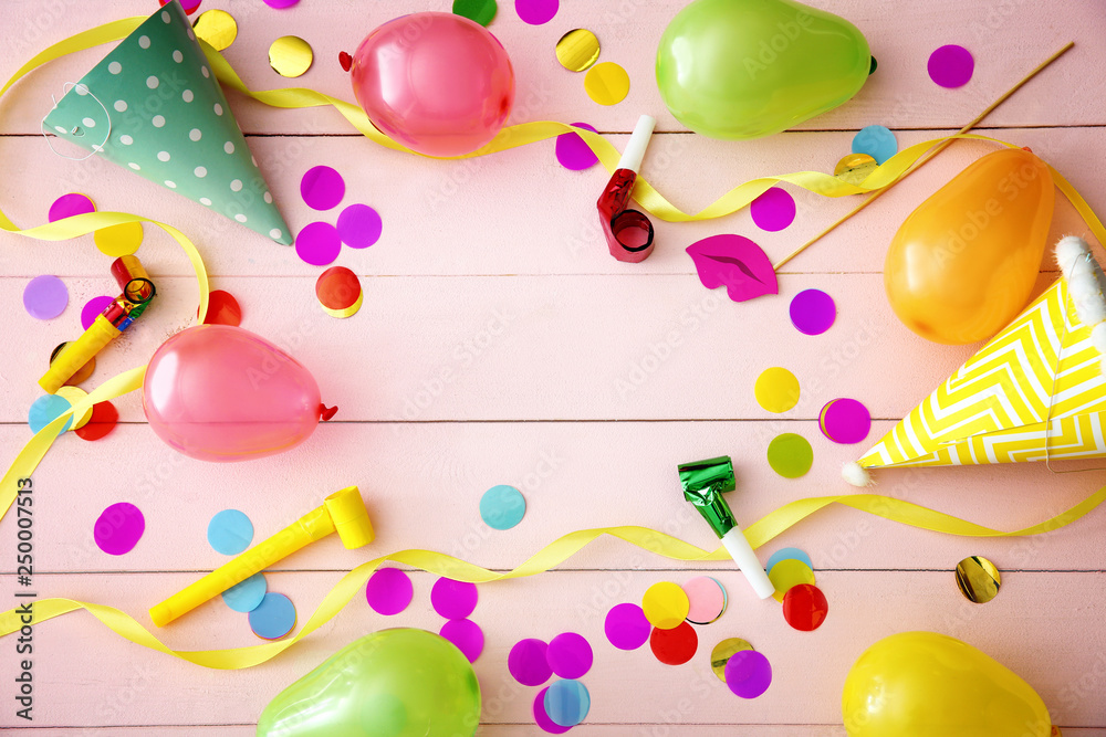 Festive composition with balloons on wooden background