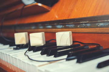 wooden cubes on piano