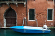 Moored boat in a quiet canal in Venice