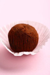 Wall Mural - Dark Chocolate truffle on pink