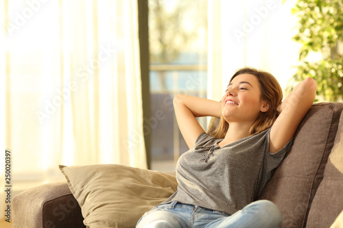 Fotomural Happy woman resting comfortably at home