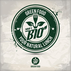 alternative green food stamp containing: two environmentally sound eco motifs in circle frames, grunge ink rubber stamp effect, textured paper background, eps10 vector illustration