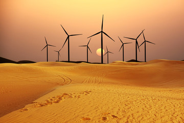 Wall Mural - Wind park in the desert at sunset, alternative energy from the nature concept