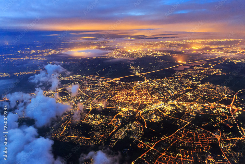 Beautiful aerial cityscape view of the city of Leiden, the Netherlands, after sunset at night in the blue hour - obrazy, fototapety, plakaty 